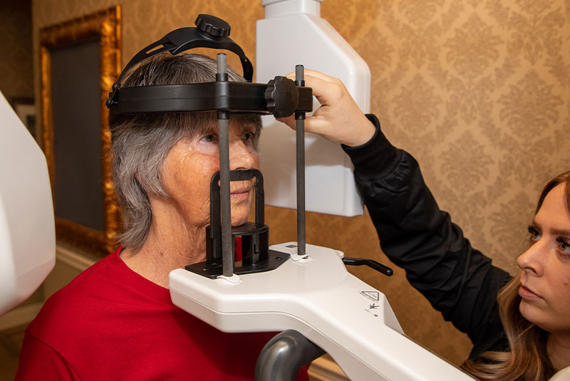 Patient being prepped for 3d dental scanning device within the dental practice