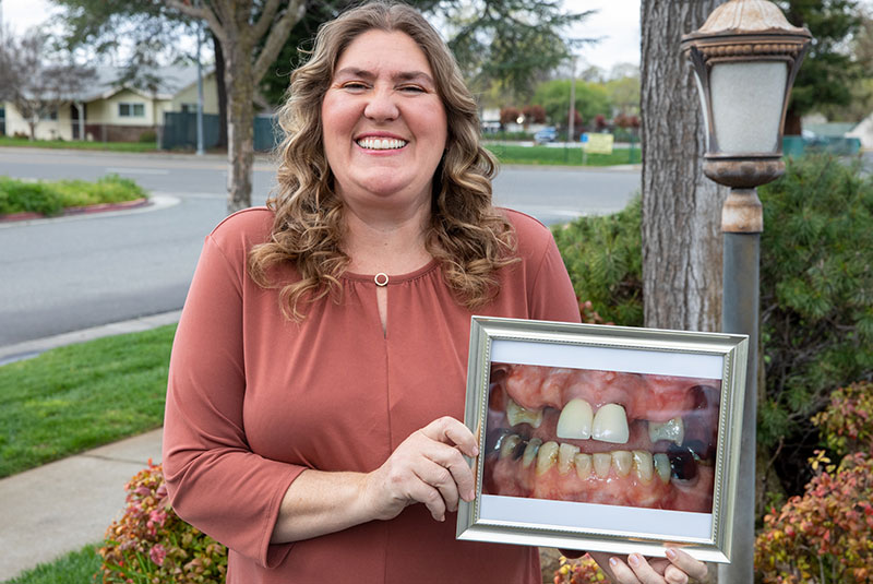 Headshot of patient outside of the dental practice